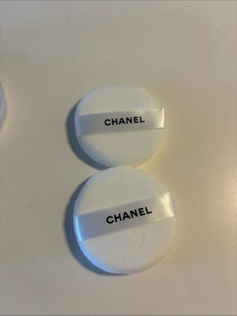 Chanel powder jars and puffs